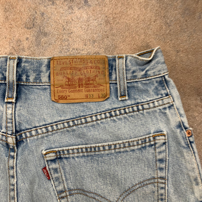 Vintage LEVI'S 560 Jeans W33 L30 Mens Relaxed Fit Tapered Blue 90s